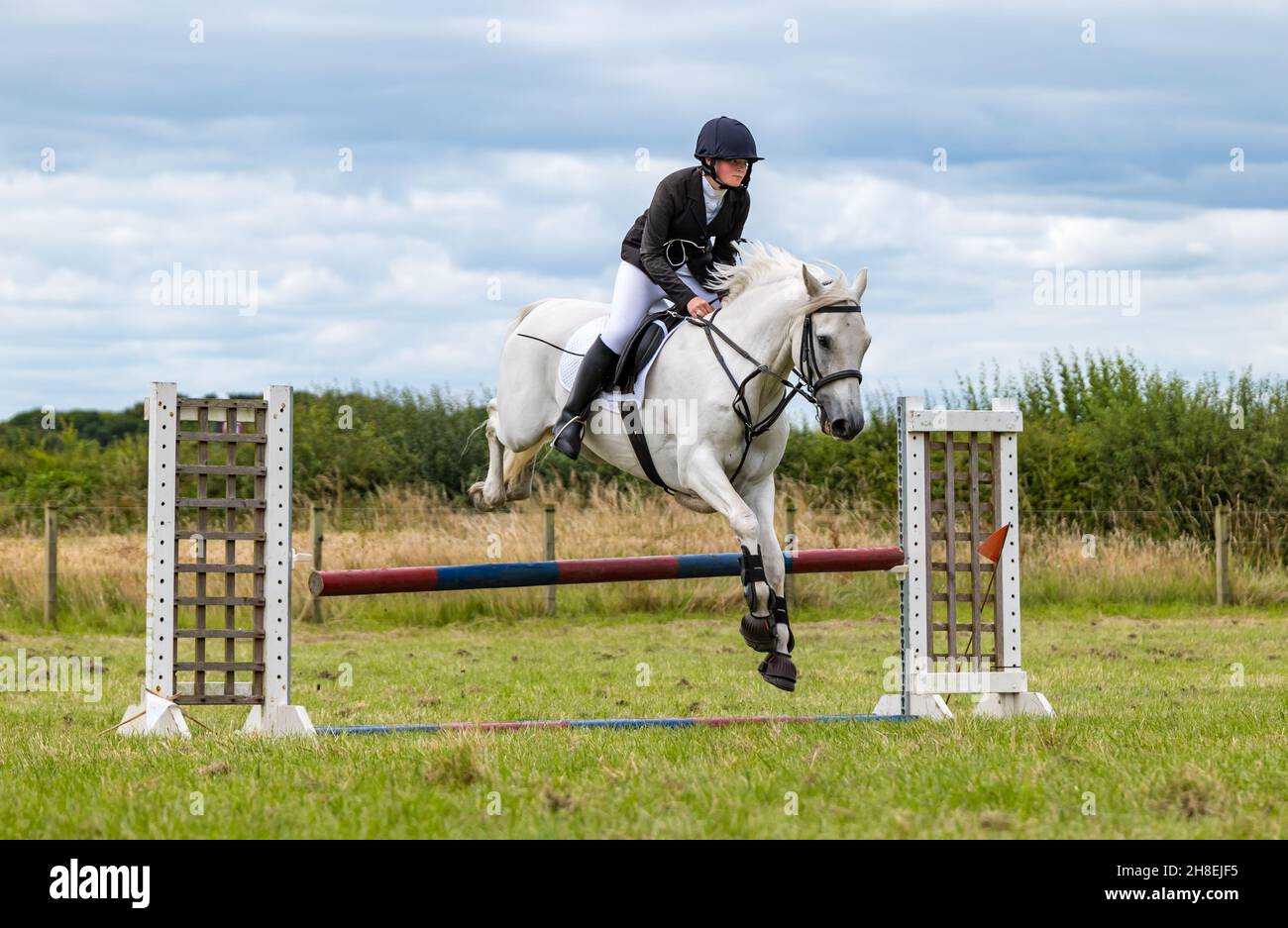 Boy horse riding helmet hi-res stock photography and images - Alamy