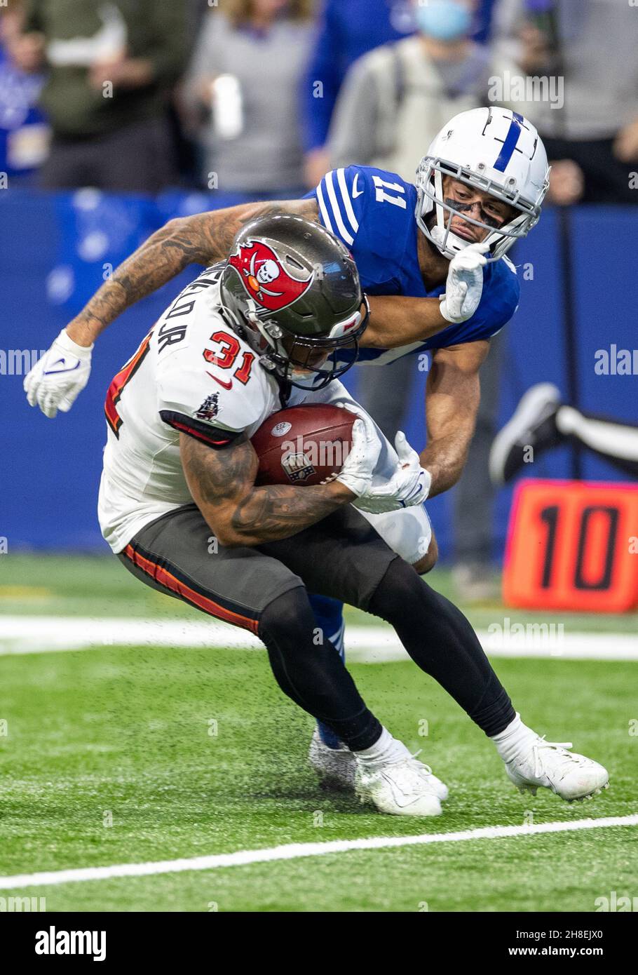 November 28, 2021: Tampa Bay Buccaneers safety Antoine Winfield Jr. (31)  returns interception during NFL football game action between the Tampa Bay  Buccaneers and the Indianapolis Colts at Lucas Oil Stadium in