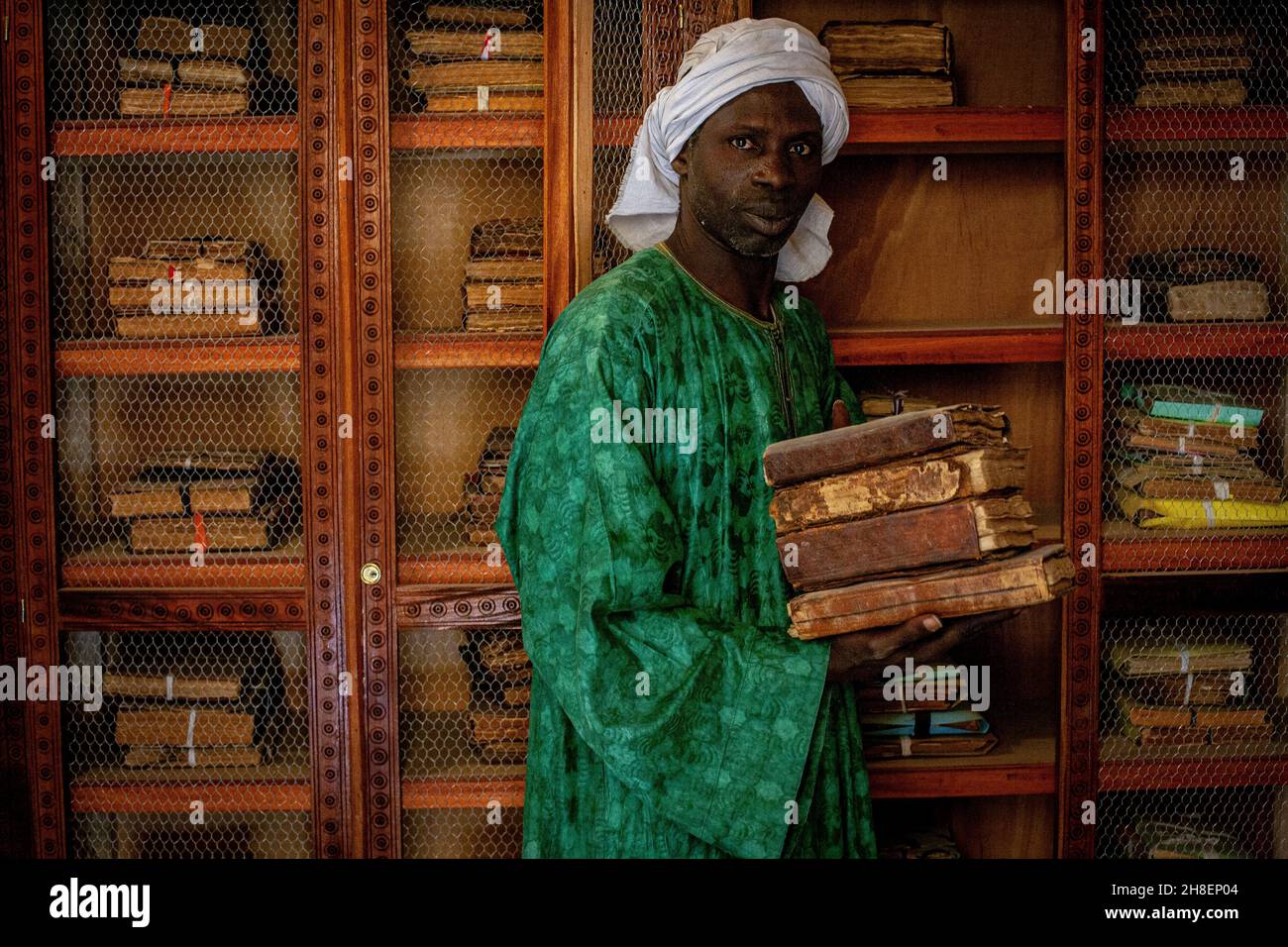 Privat library  Al- Wangari Al Wangari library scholar holding manuscripts in Timbuktu , Mali, Africa. Stock Photo