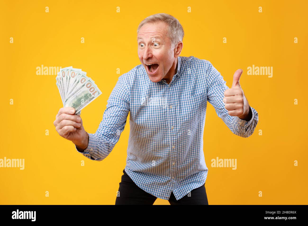 Old happy man holding thumbs hi-res stock photography and images - Alamy