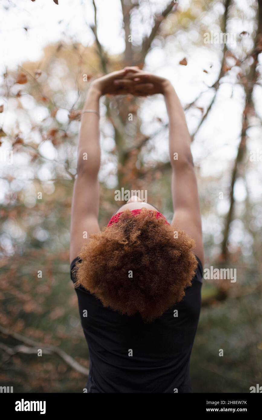 Young woman stretching arms hi-res stock photography and images - Alamy