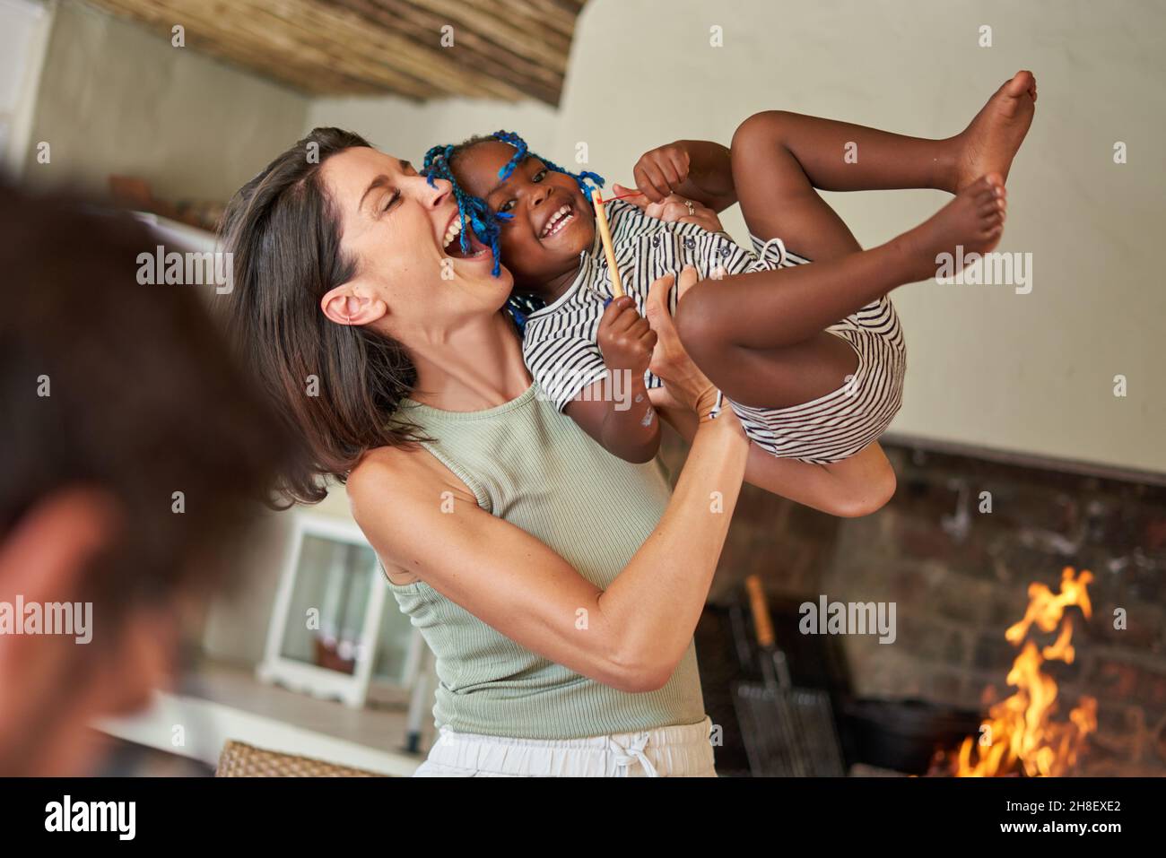 Happy playful mother and daughter at home Stock Photo