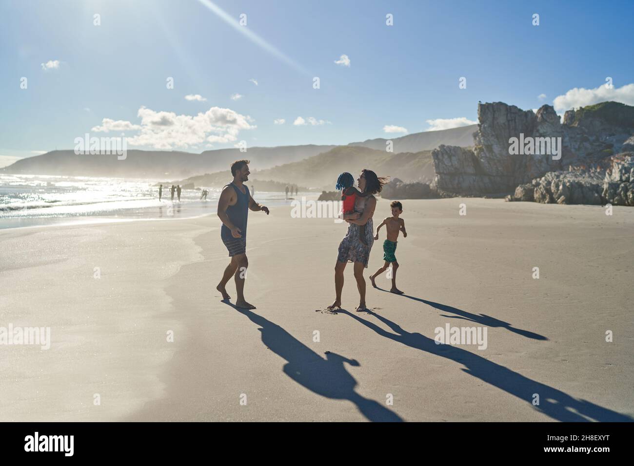 Beach playing family hi-res stock photography and images - Alamy