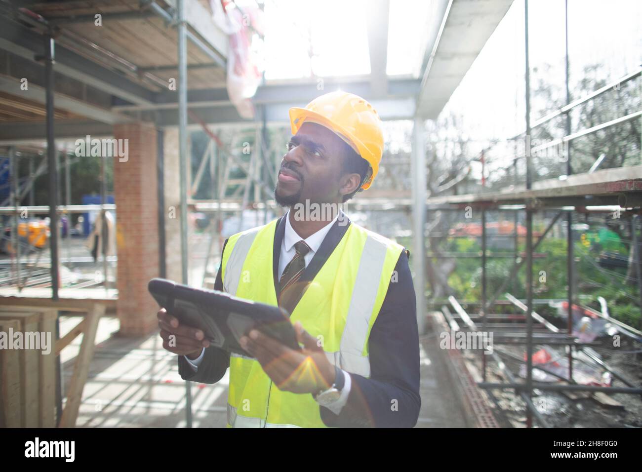 Engineer with digital tablet at construction site Stock Photo