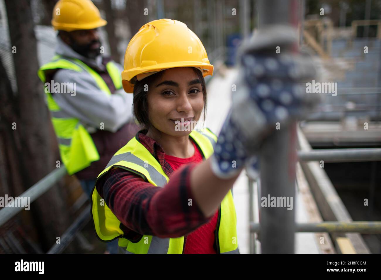 Portrait confident female construction worker at construction site ...