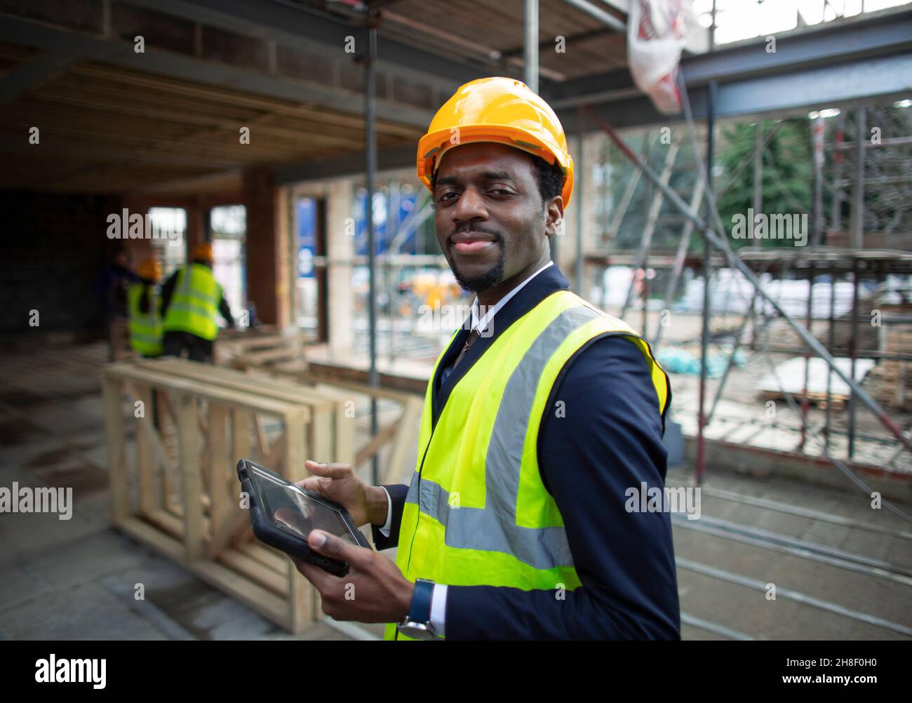 Portrait confident male architect at construction site Stock Photo