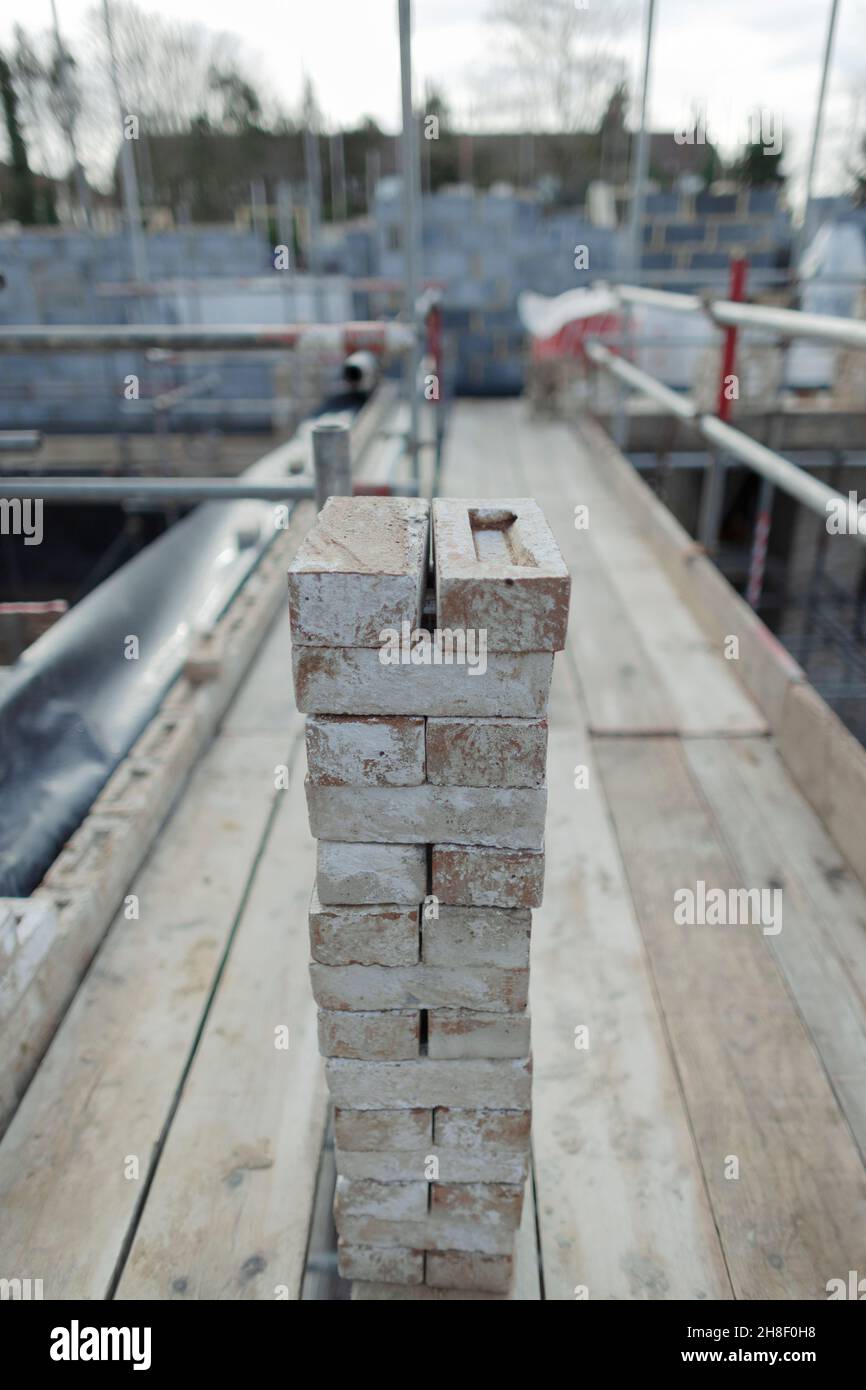 Stacked bricks at construction site Stock Photo