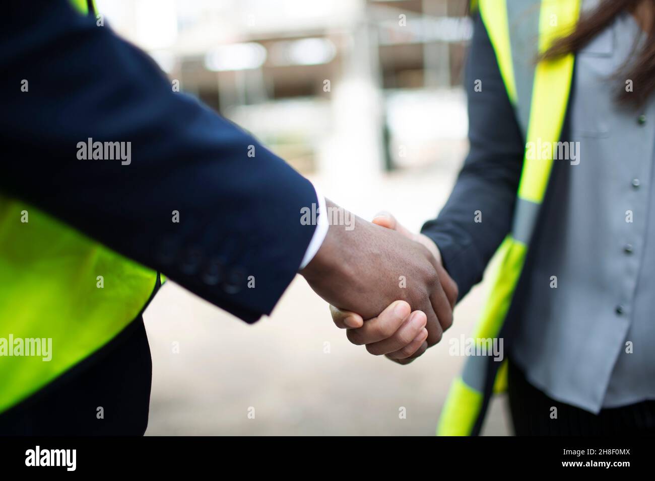 Close up foreman and engineer shaking hands Stock Photo