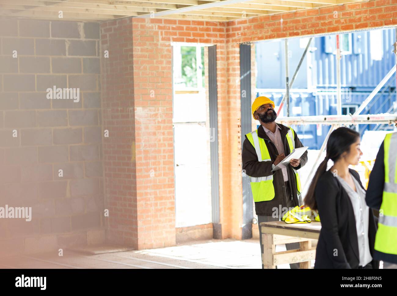Engineer with digital tablet at construction site Stock Photo