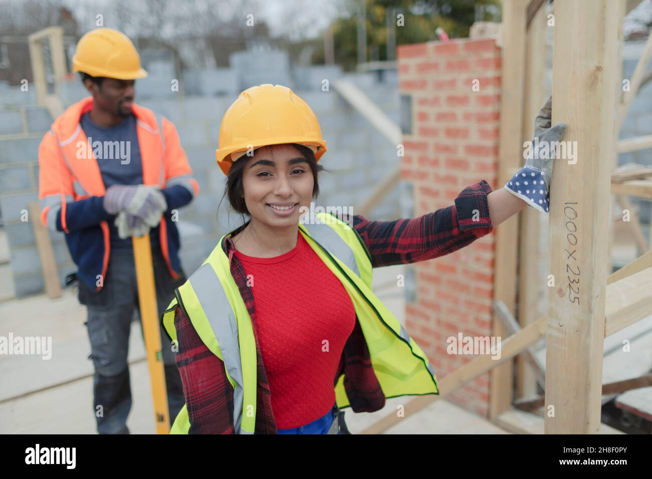 Portrait confident female construction worker at construction site Stock Photo