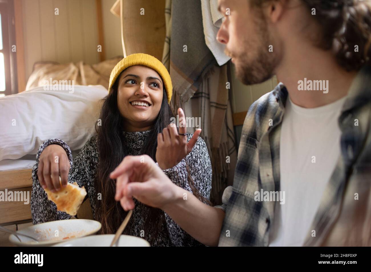 Young couple eating and talking Stock Photo