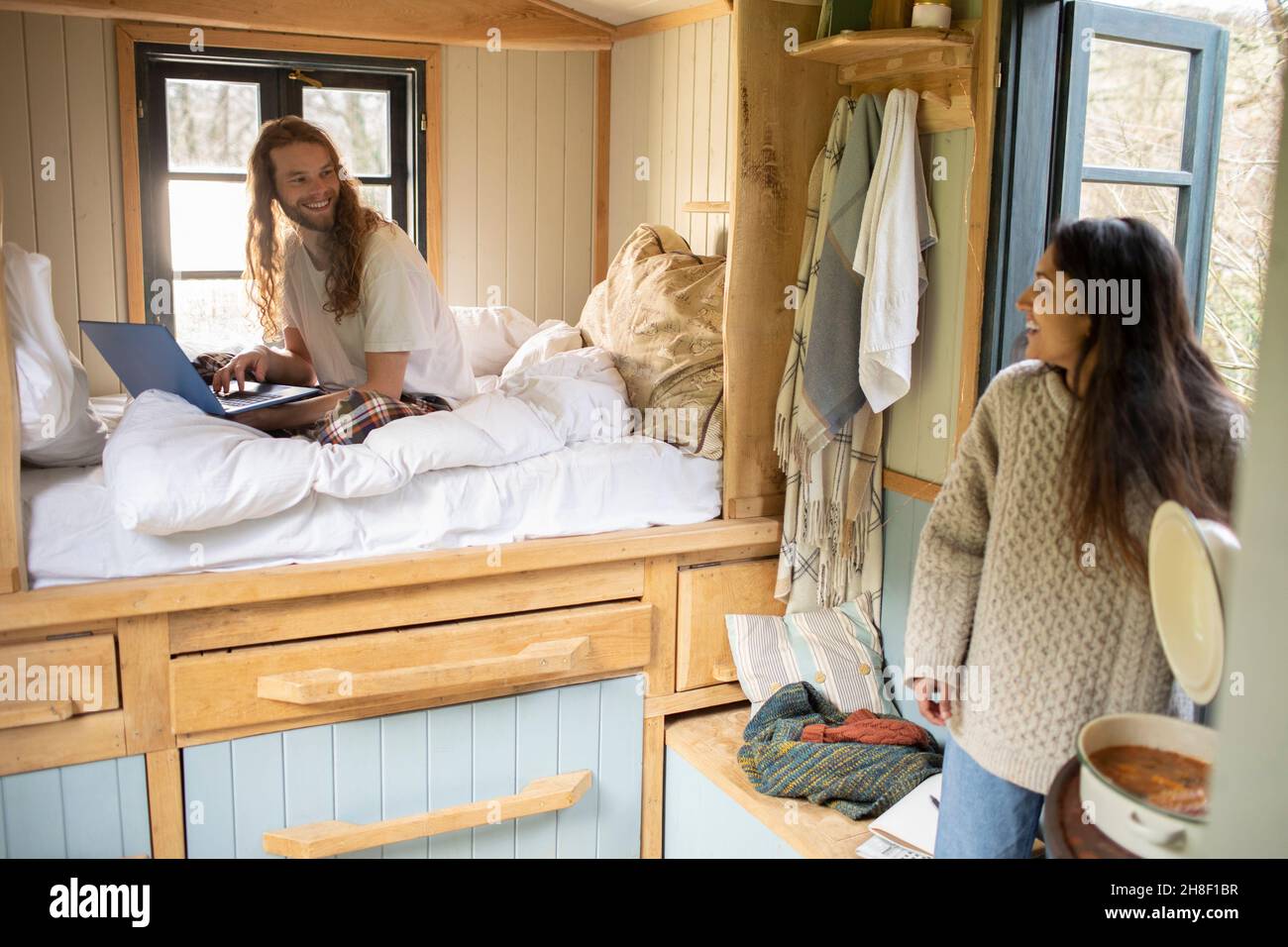 Young couple in tiny cabin rental Stock Photo