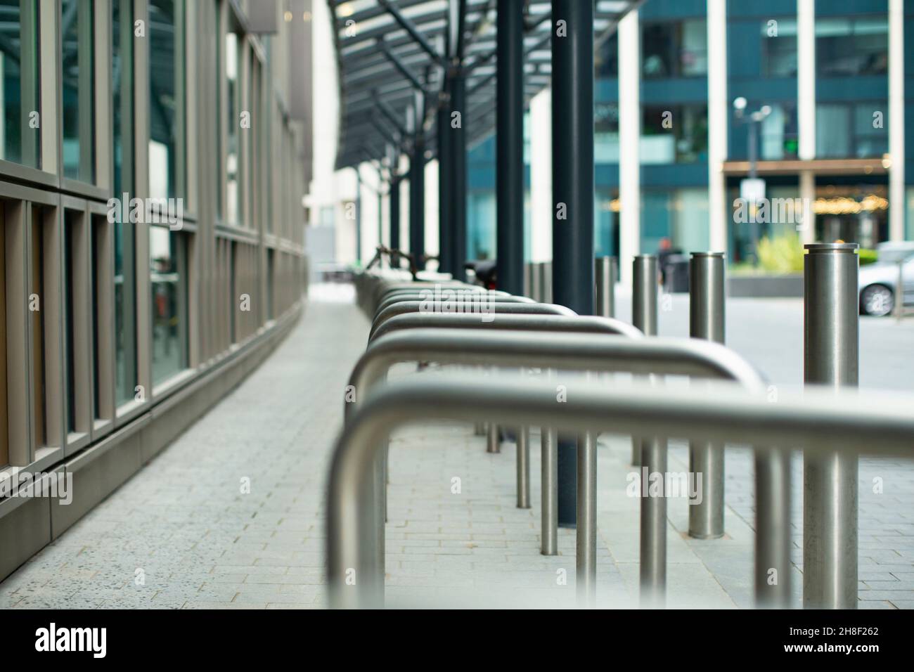 Bike racks on urban sidewalk Stock Photo Alamy