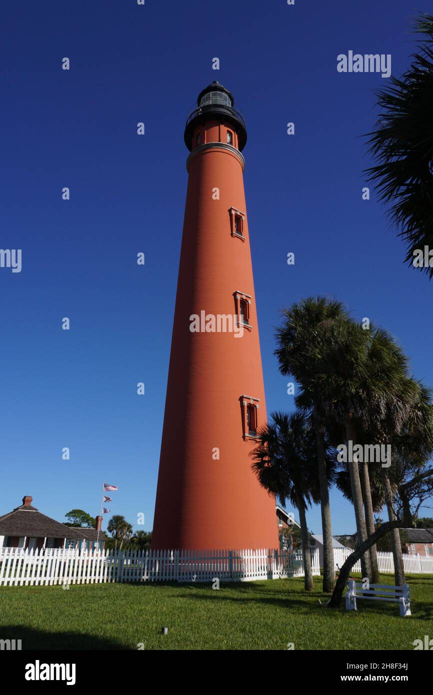 View of the Ponce Inlet Lighthouse, just south of Daytona Beach, Florida against a blue cloudless sky. Stock Photo