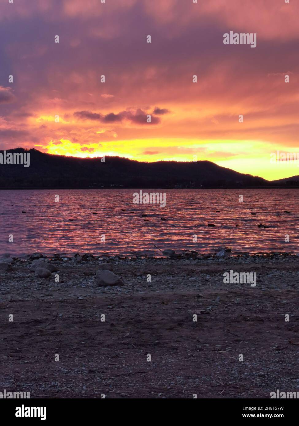 red sunset lake constance with colorful clouds Stock Photo - Alamy