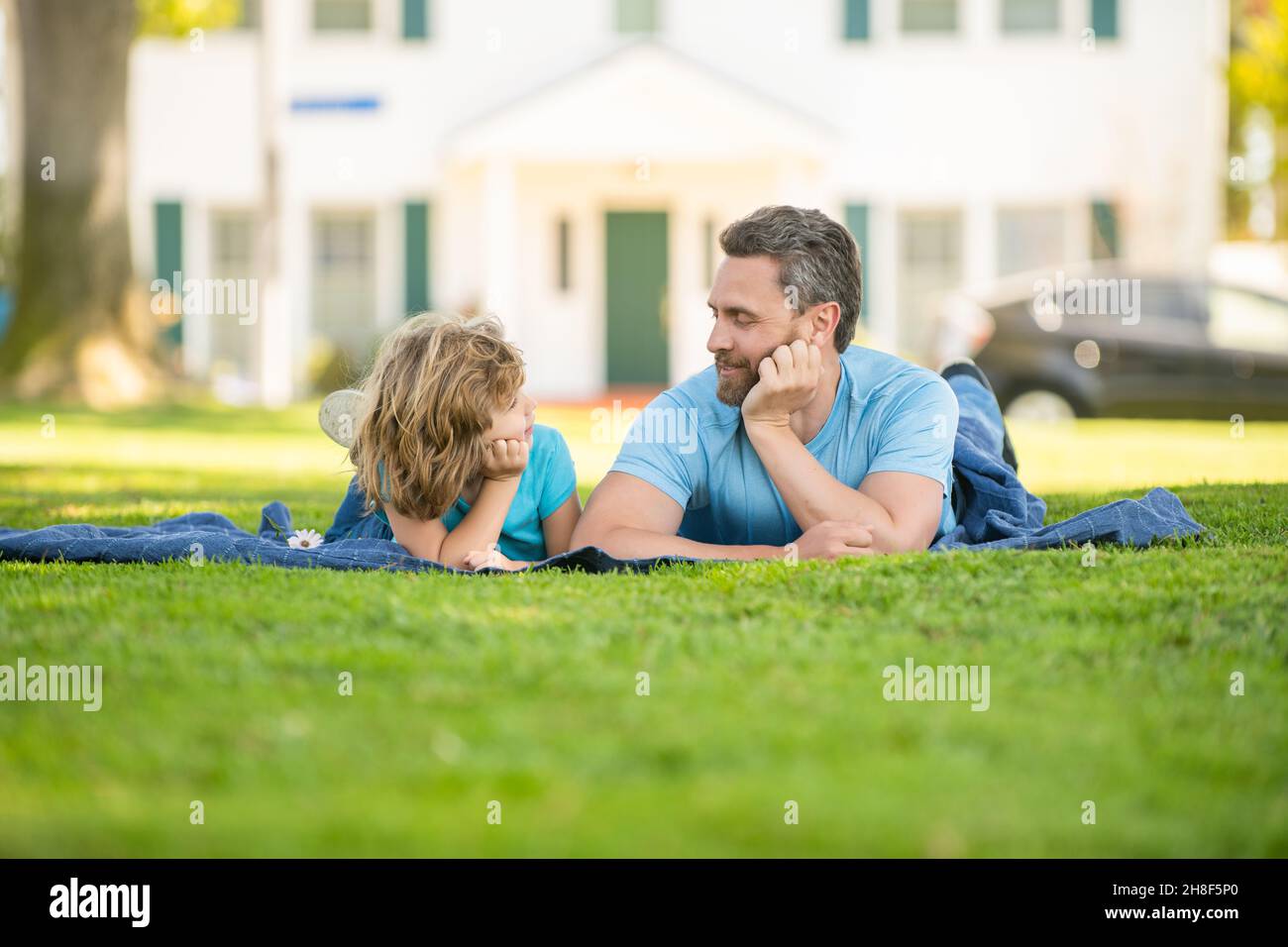 smiling father and son having fun in park. family value. childhood and parenthood. Stock Photo