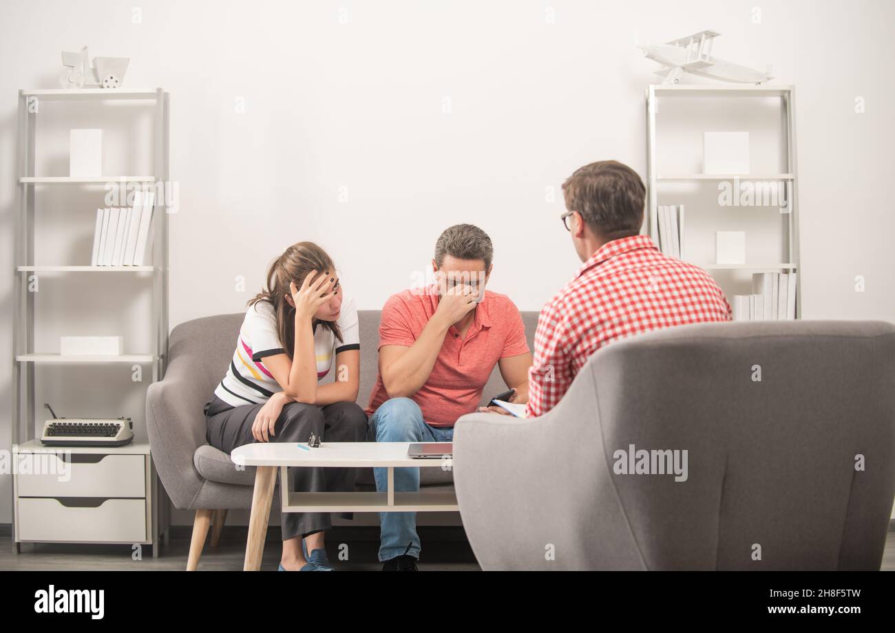 family couple with relationship problems at psychologist, therapy Stock Photo