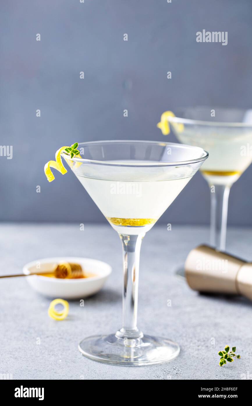 Honey and thyme lemon drop martini with garnish Stock Photo Alamy