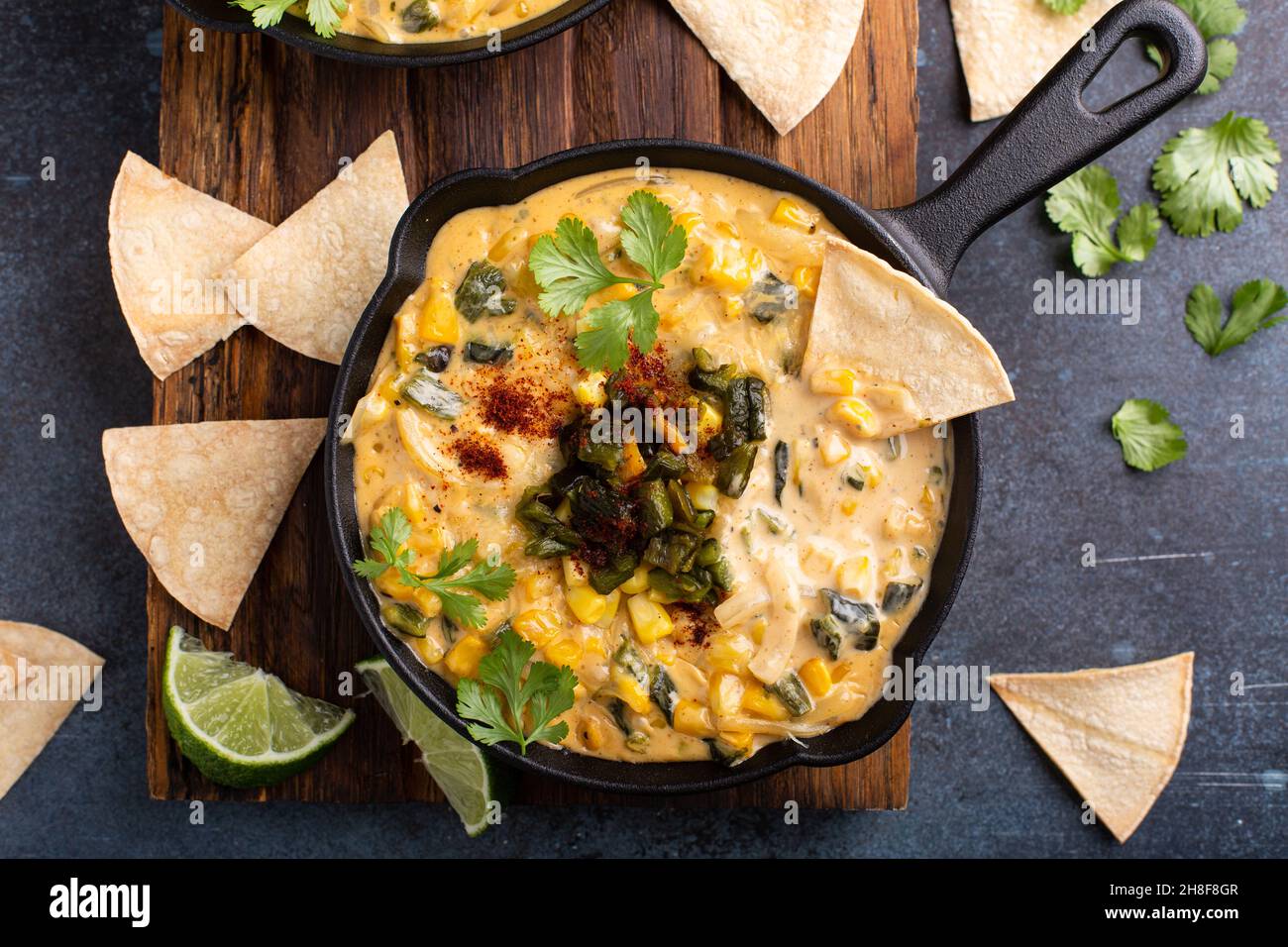 Grilled poblano and corn dip with tortilla chips Stock Photo