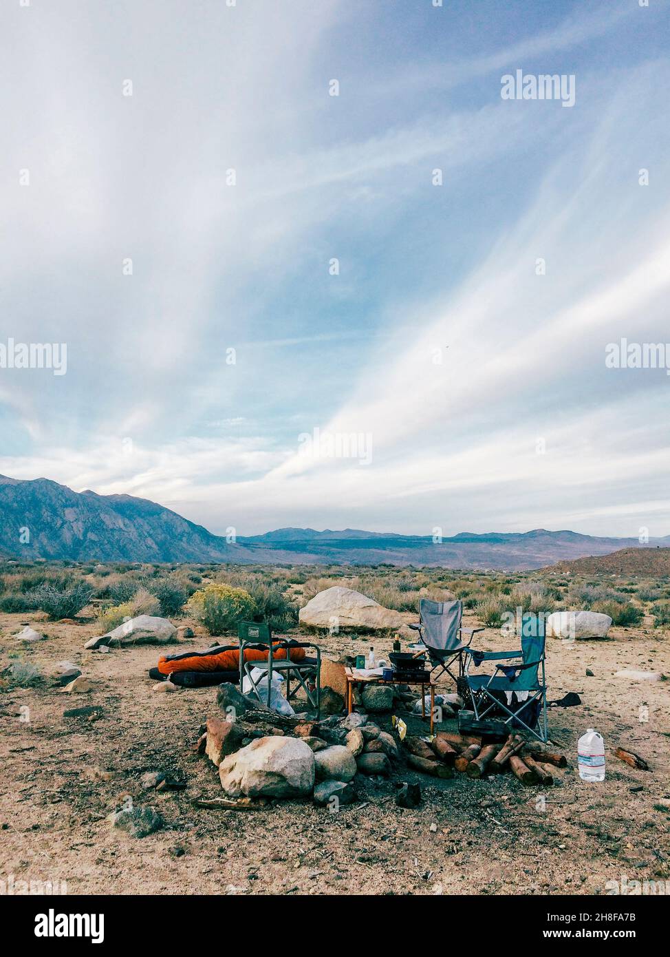 Camp chairs around the fire in Bishop, California Stock Photo