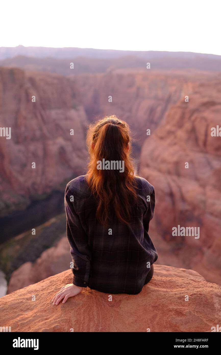 Woman sitting on cliff edge hires stock photography and images Alamy