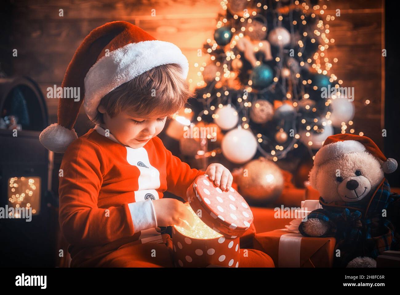 Christmas kids. Happy little child boy with christmas gift box. Gift