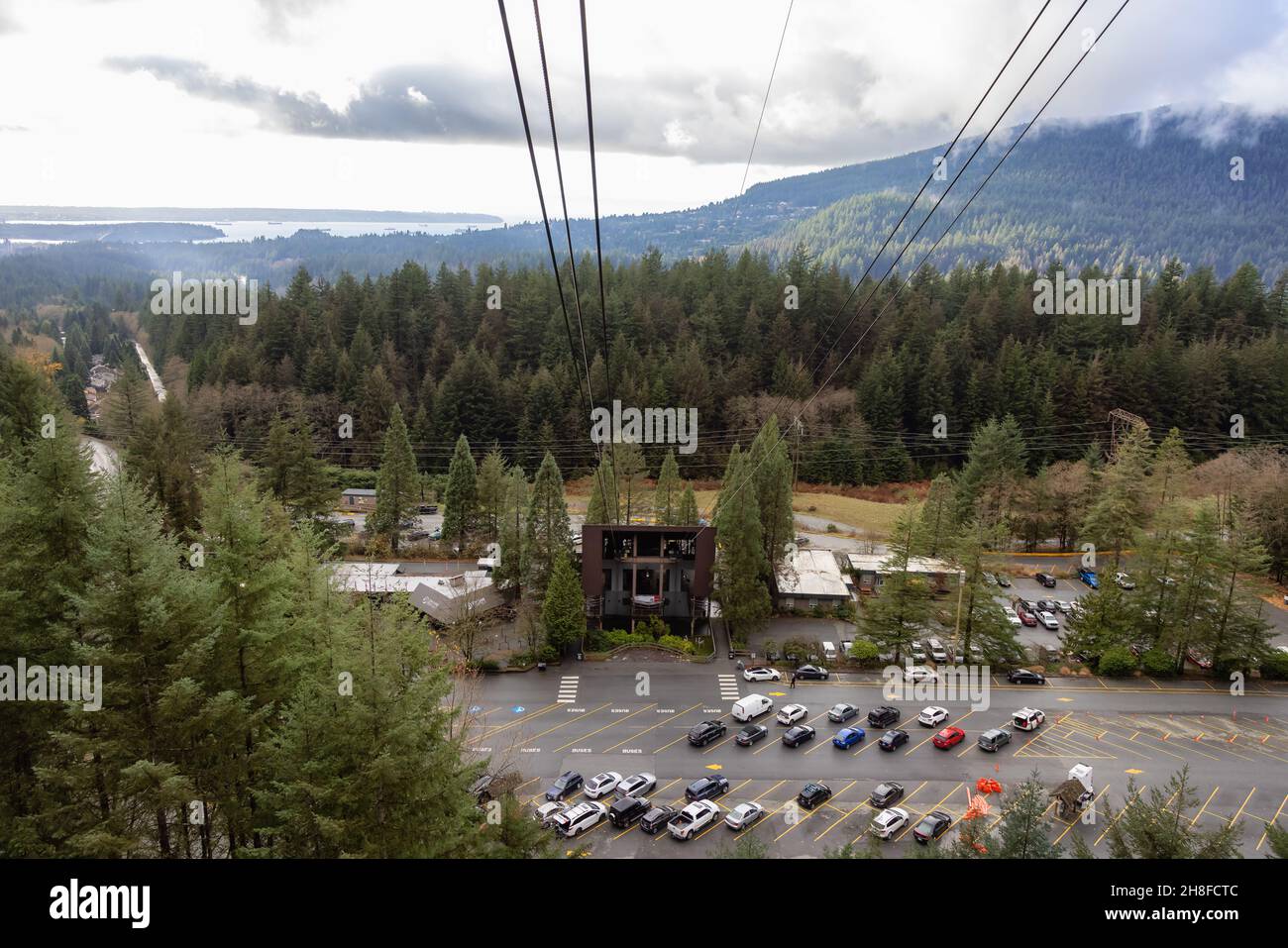 View of the Parking Lot and Grouse Mountain Gondola Station during a cloudy day. Stock Photo