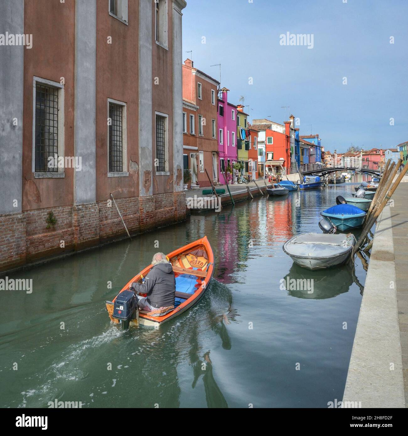 typical canal in Burano island at venice lagoon Stock Photo