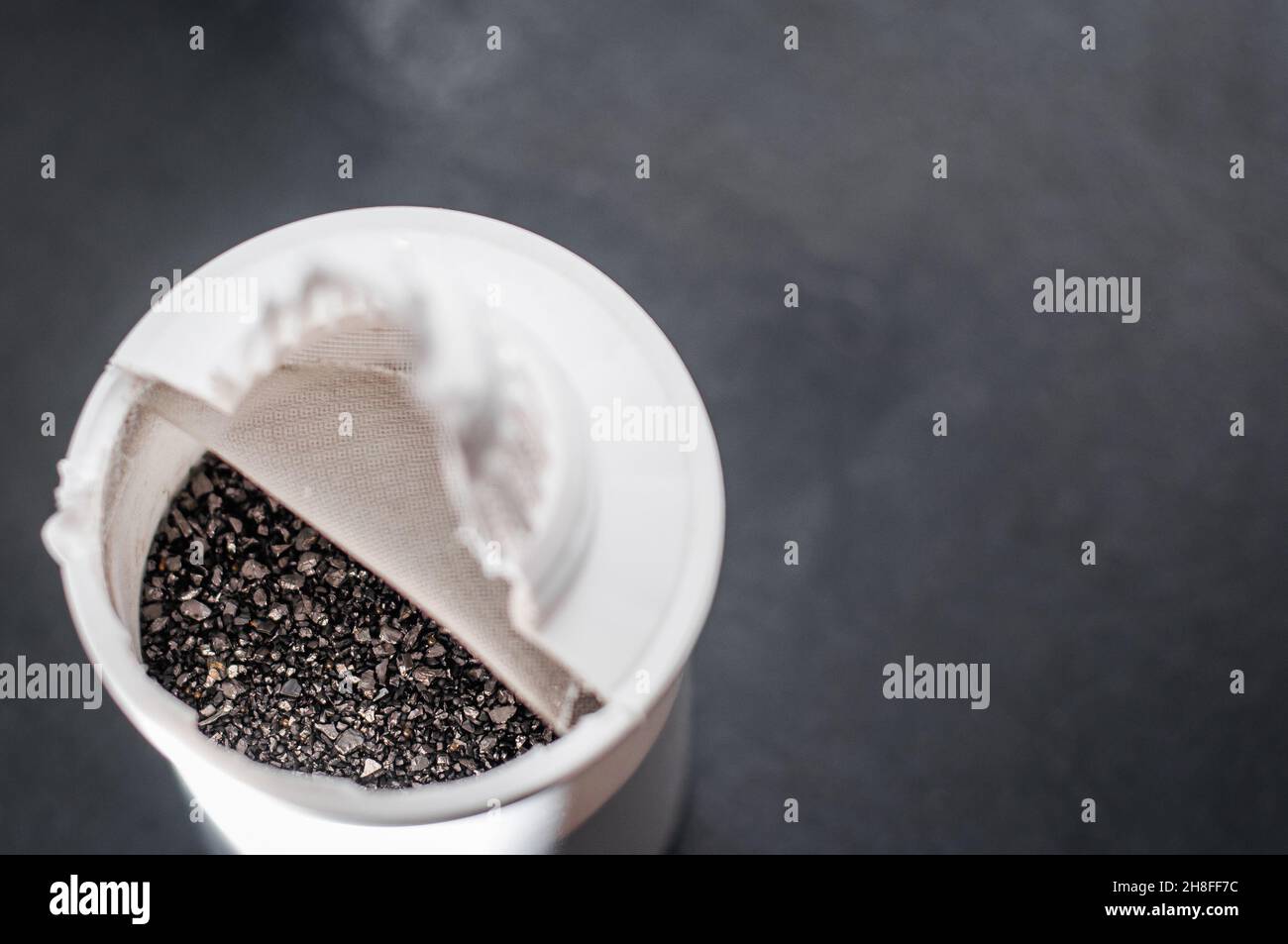 Internal filling of activated carbon water filter Stock Photo Alamy