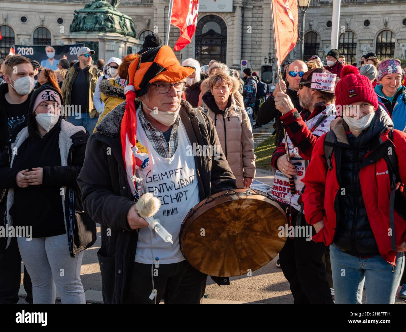 Vienna, Austria - November 20 2021: Strange Anti-Vax Covid-19 Demonstrator Drumming on Heldenplatz, in Odd Costume Stock Photo