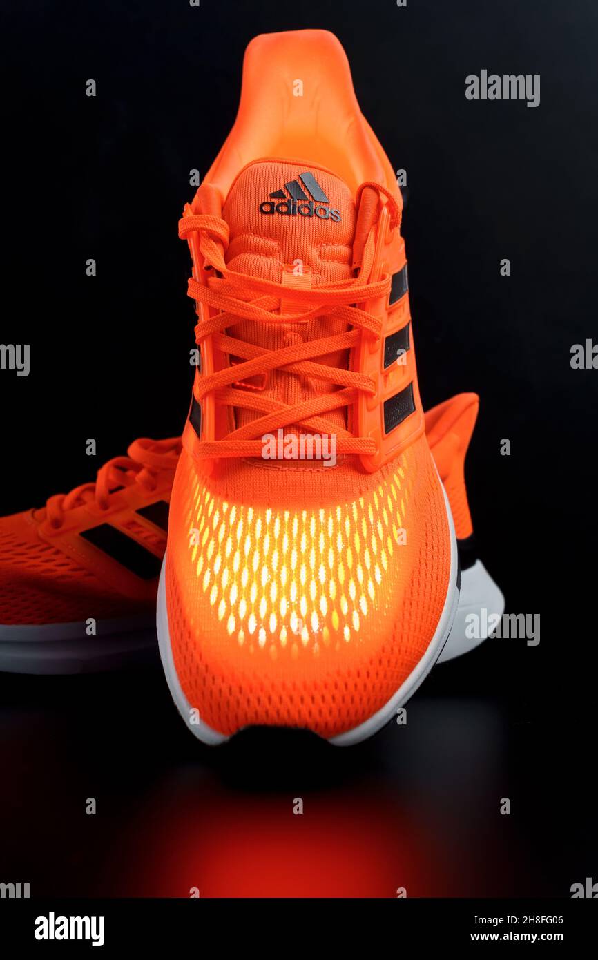 Tyumen, Russia-November 13, 2021: New orange color adidas sneakers. Logo  close-up. Vertical photo Stock Photo - Alamy