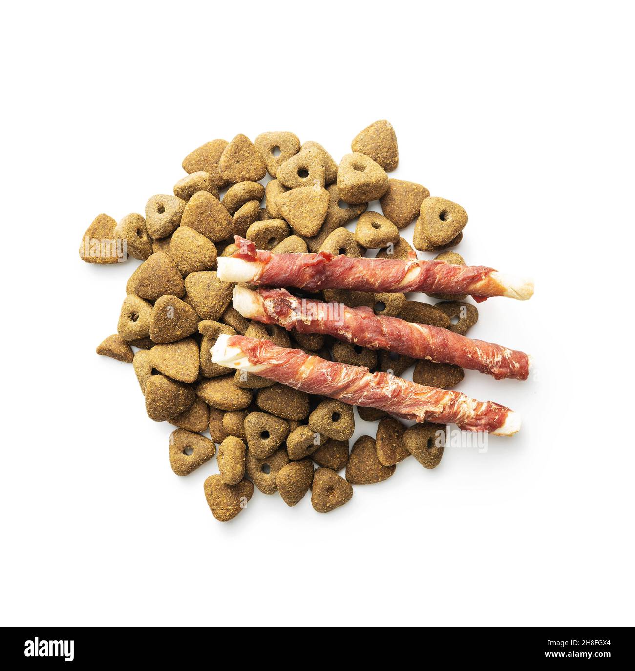Dog treat sticks. Chewy sticks for dog and dry kibble isolated on white