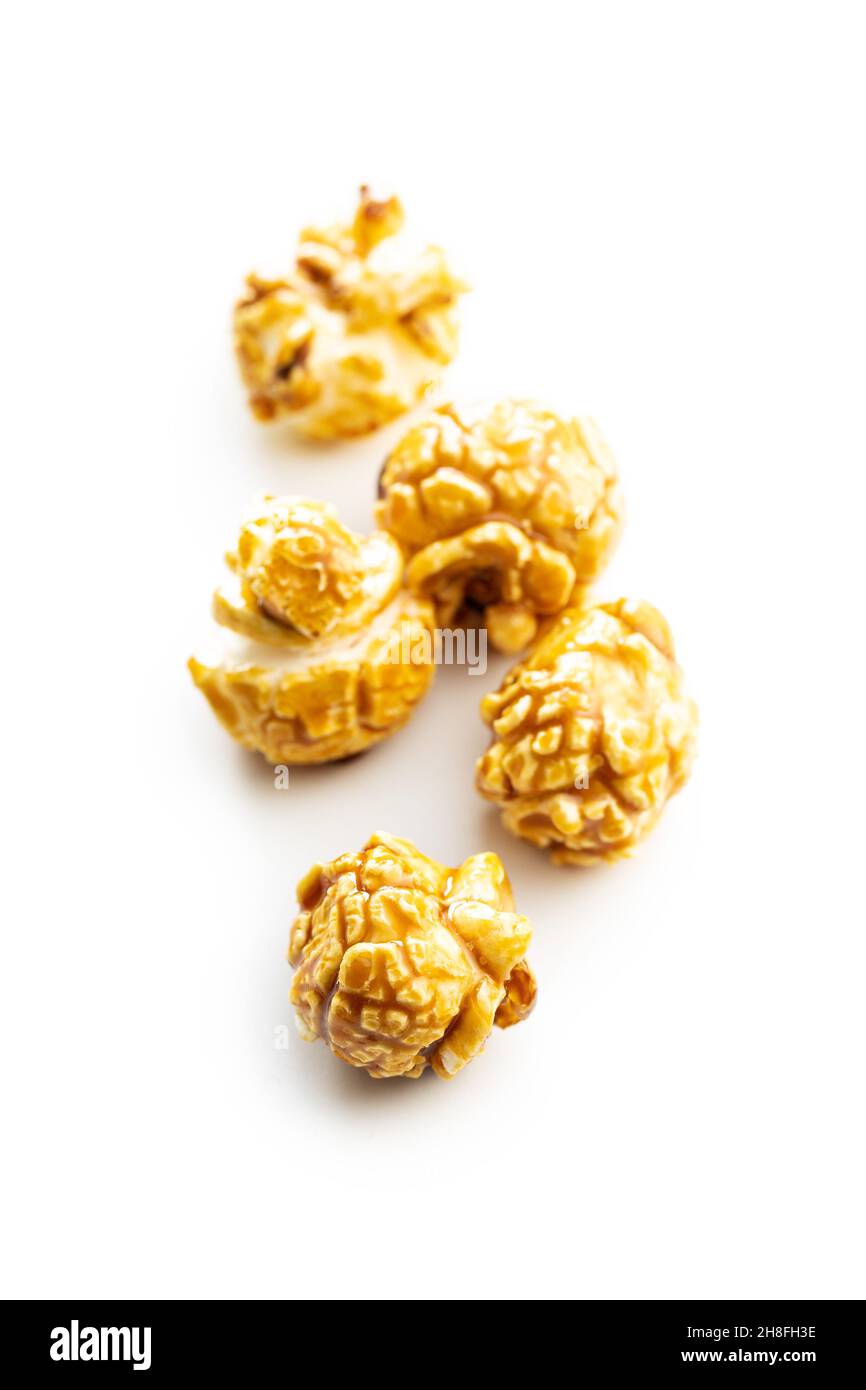 Sweet caramel popcorn isolated on white background. Stock Photo