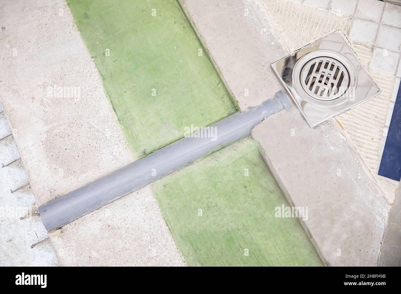 Drainage device from shower tray, bathroom renovation plumbing concept. Stock Photo