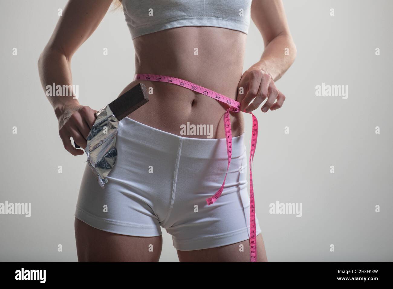 https://c8.alamy.com/comp/2H8FK3W/woman-with-measuring-tape-weight-loss-concept-slim-girl-with-centimeter-closeup-woman-measuring-her-waist-with-tape-2H8FK3W.jpg