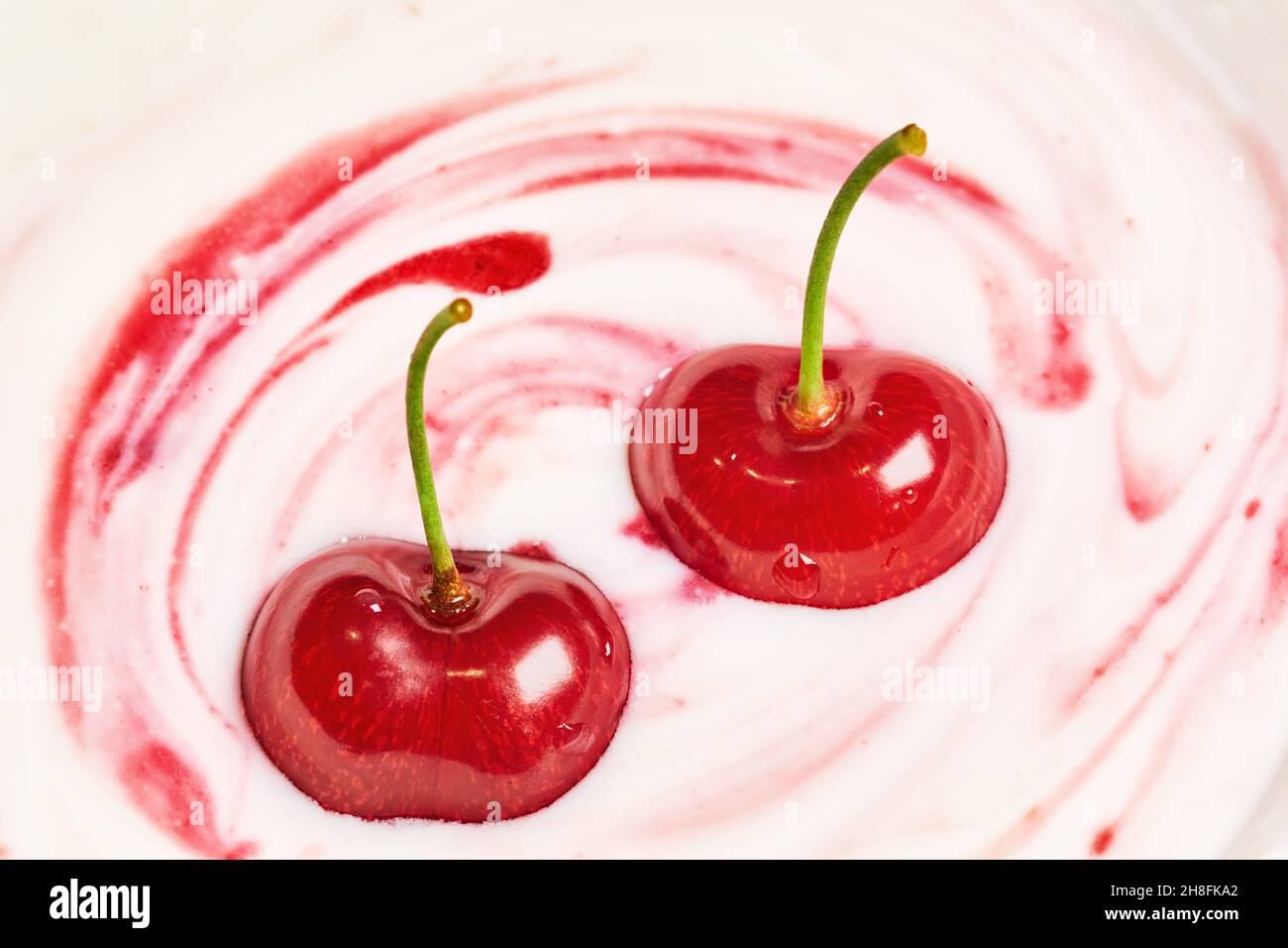 Milk dessert with berries and jam Stock Photo