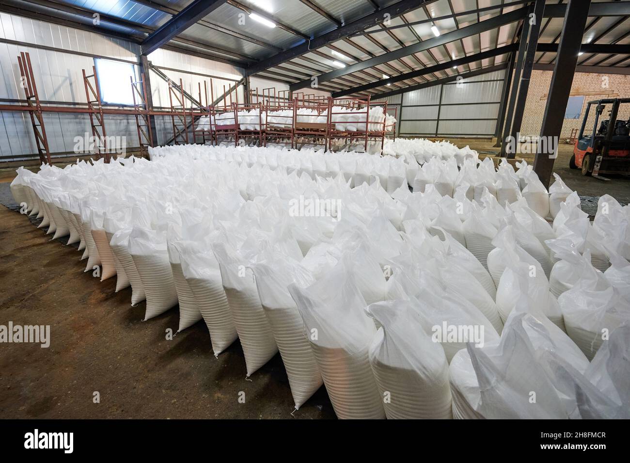 Many white bags in warehouse store for shipment Stock Photo