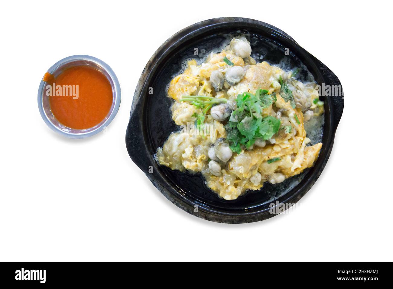 Die cut of Raw Oysters fried in egg batter hot pan on white isolated Stock Photo Alamy