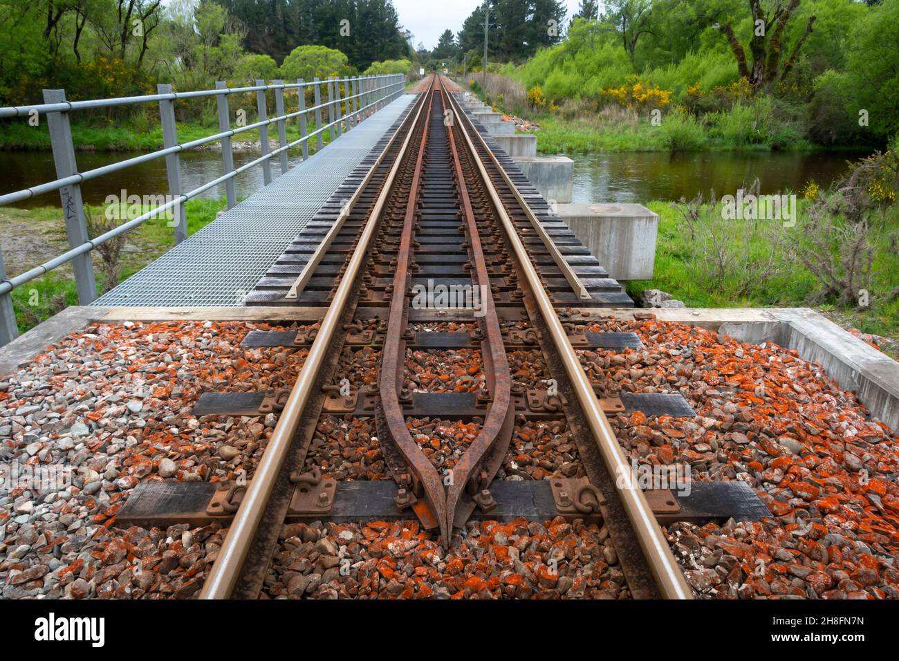 Straight railway line near Moana, Westland, South Island, New Zealand Stock Photo