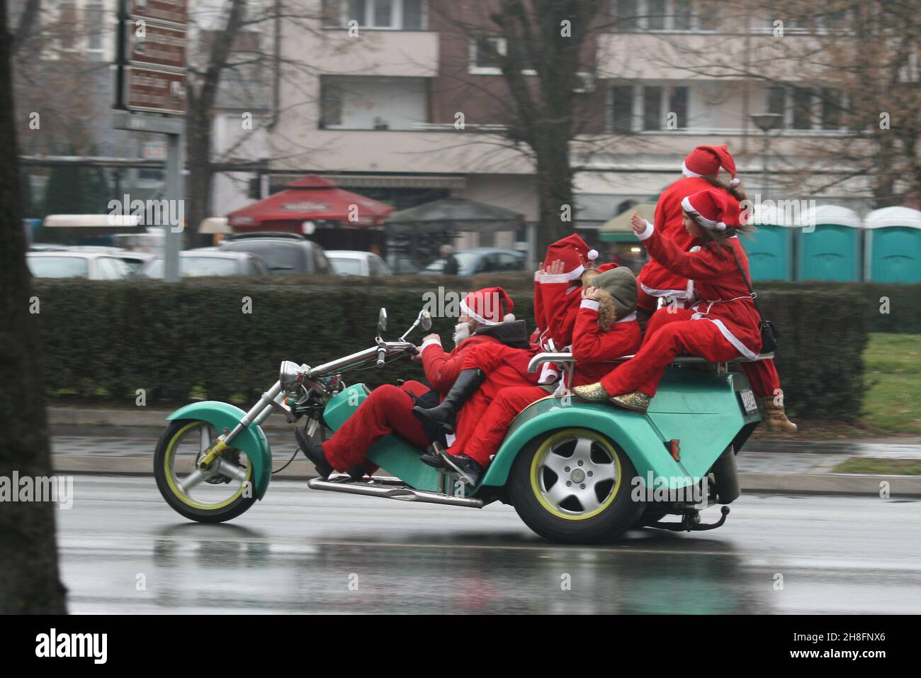 The group of Santa Clauses on the bike in Banja Luka Stock Photo