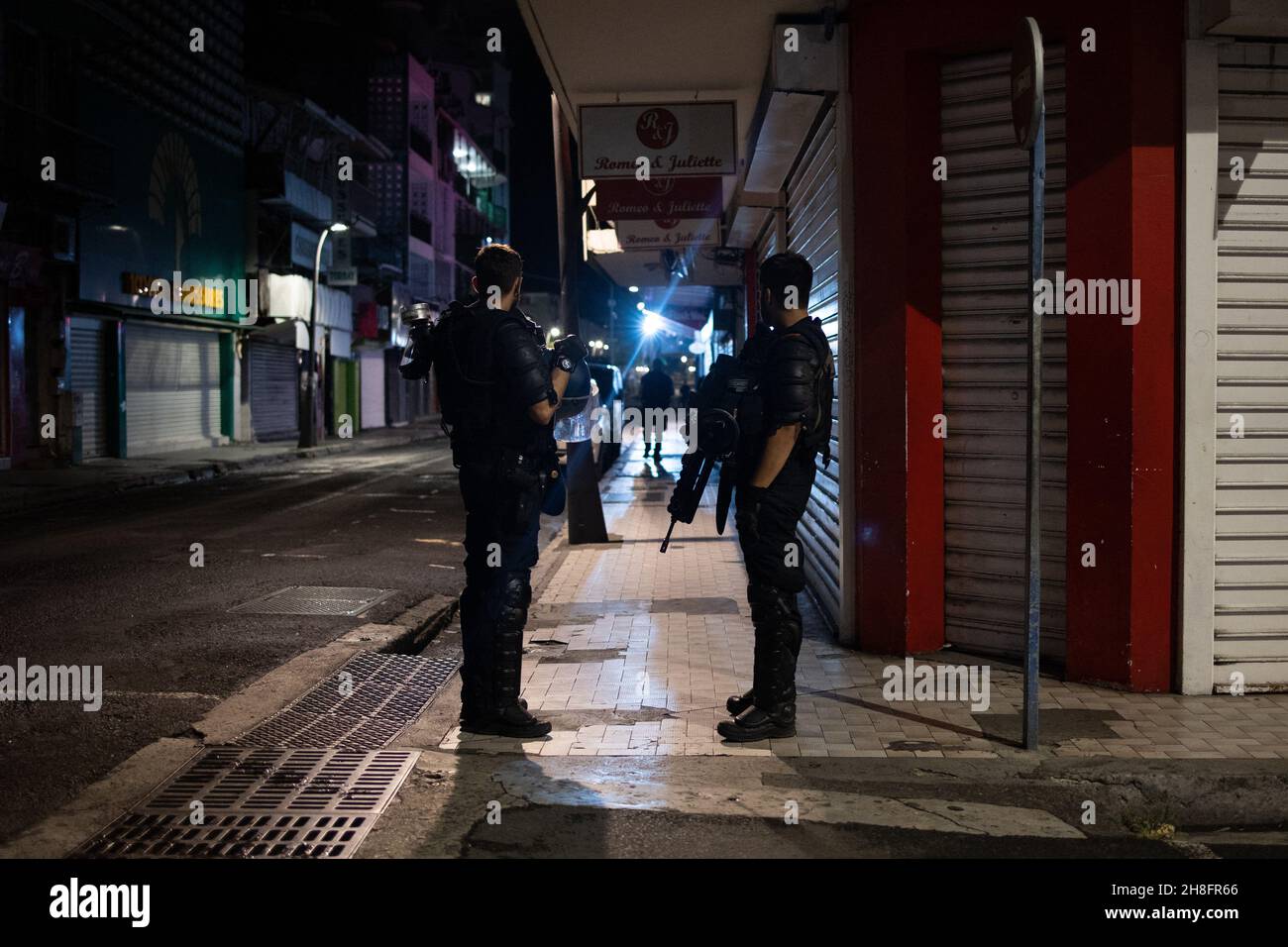 Gendarmerie and police officers patrol in a street of PointeaPitre