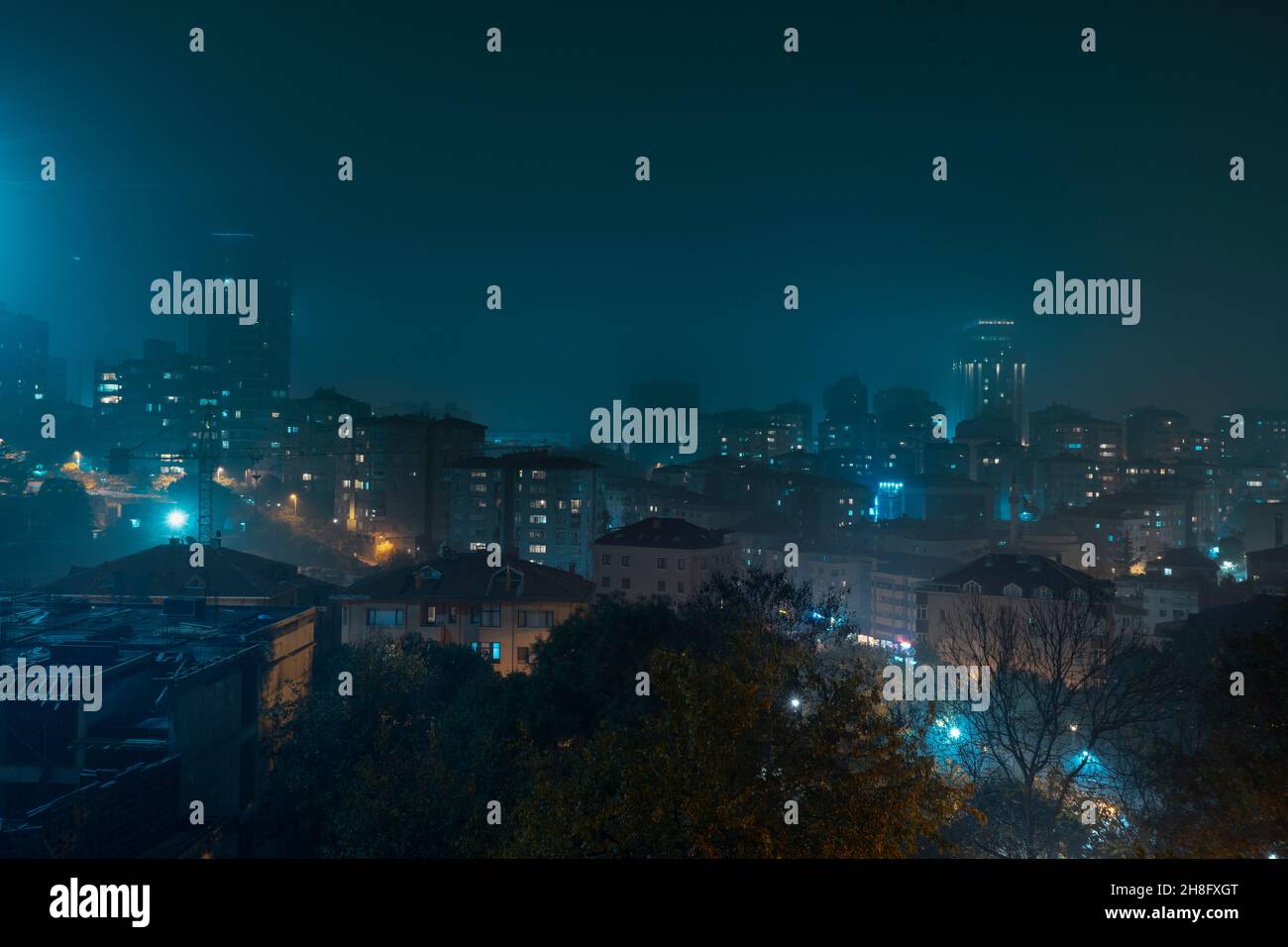 Foggy weather at night with city view in Istanbul. Stock Photo