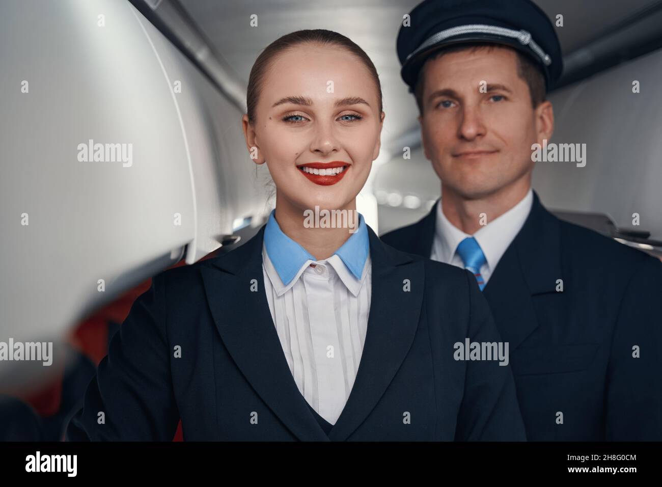 Male pilot female cabin crew hi-res stock photography and images - Alamy