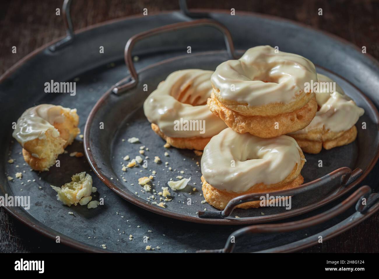 Tasty spanish donuts with white chocolate. Donuts baked at home. Simple