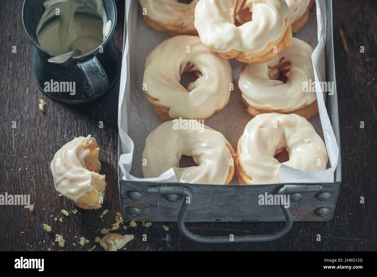 Sweet spanish donuts with white chocolate. Donuts baked at home. Simple