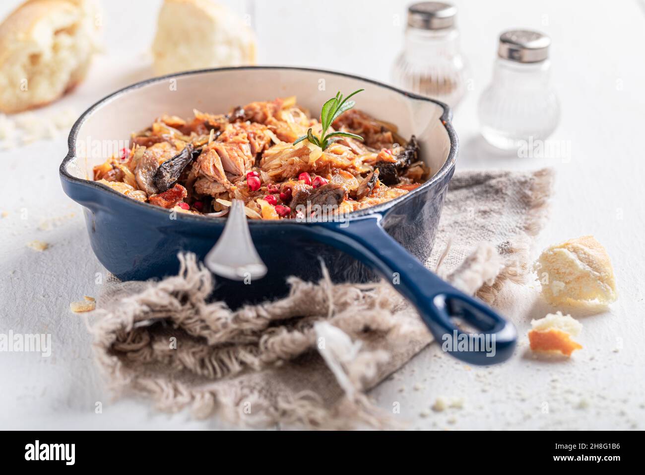 Tasty stewed cabbage and meat with beef and sauerkraut Bigos is traditional Polish food. Stock Photo