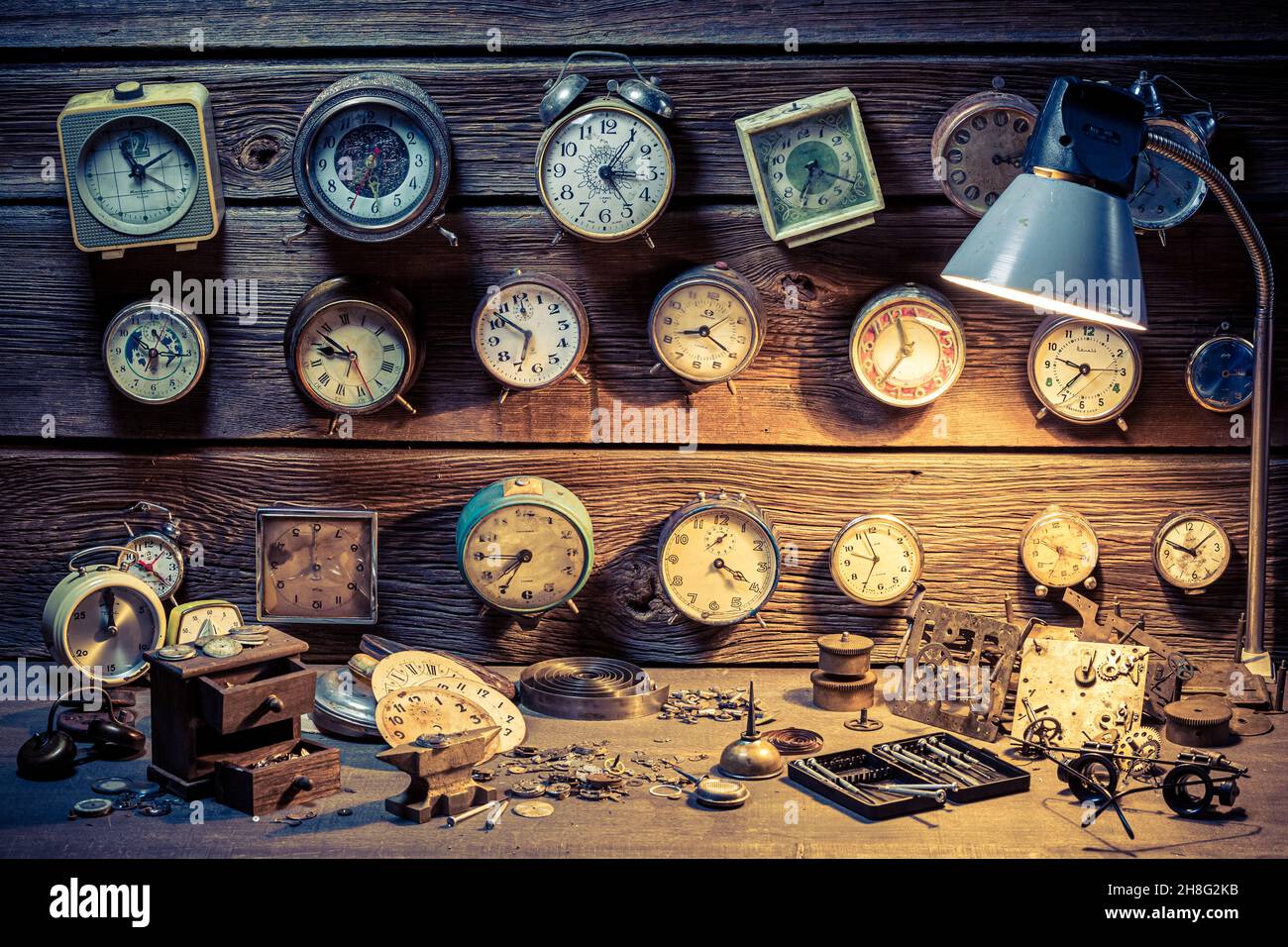Watchmaker's with vintage clocks. Ancient watchmaker's