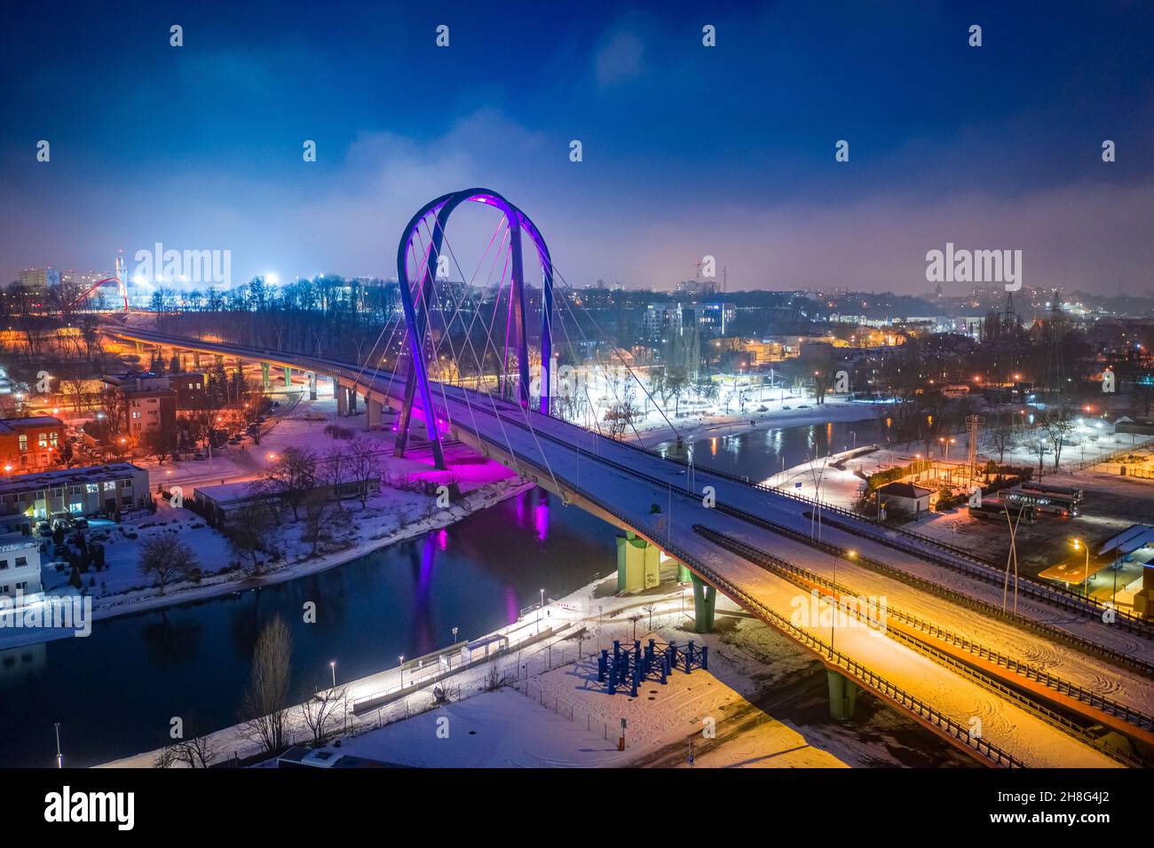 Bridge over Brda river by night. Route in Bydgoszcz. Aerial view of Poland. Stock Photo
