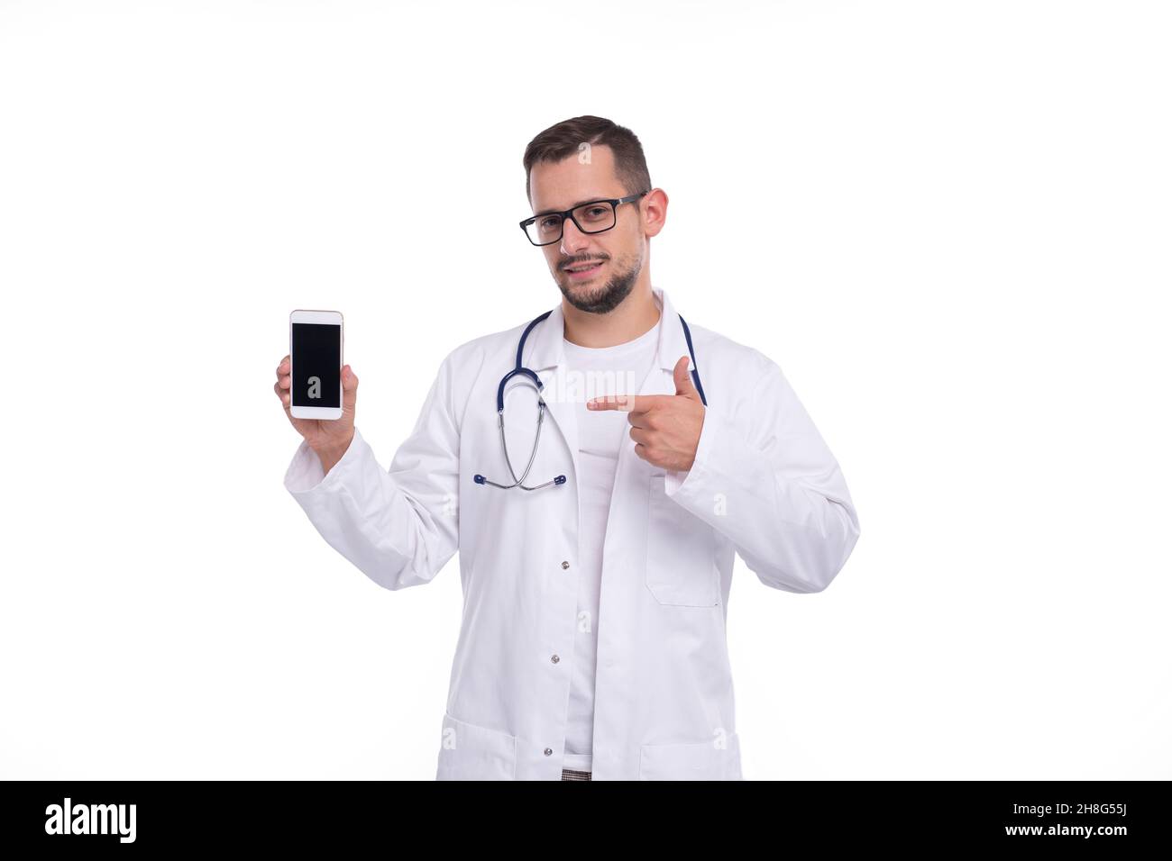 Doctor Pointing at Phone Isolated. Man Doctor Phone in Hands Stock Photo