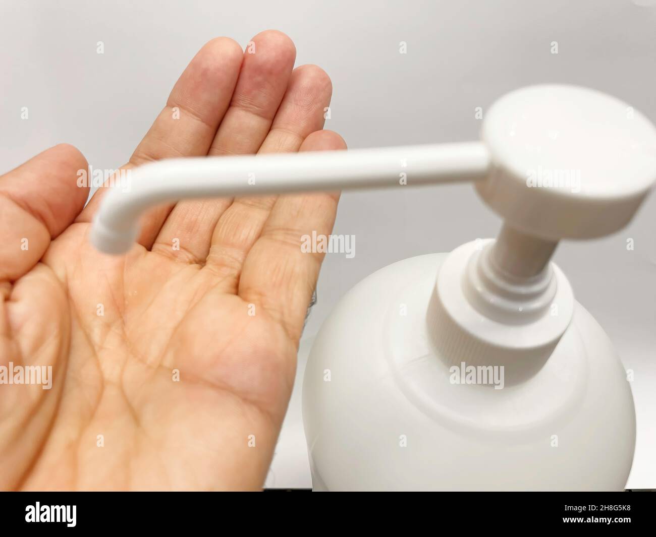 hand cleaning with disinfectant and liquid soap for hygiene Stock Photo